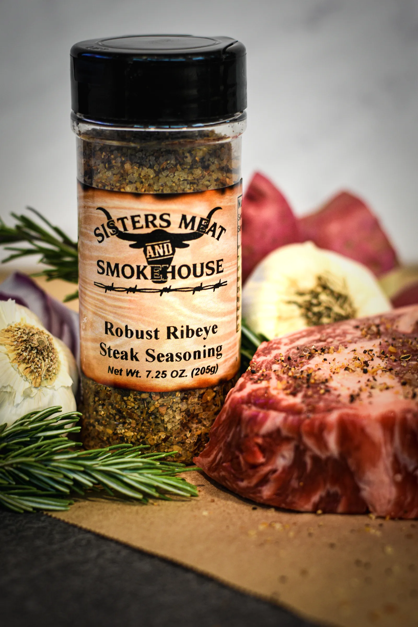 Seasoning poured over a cut of steak, caught mid-fall